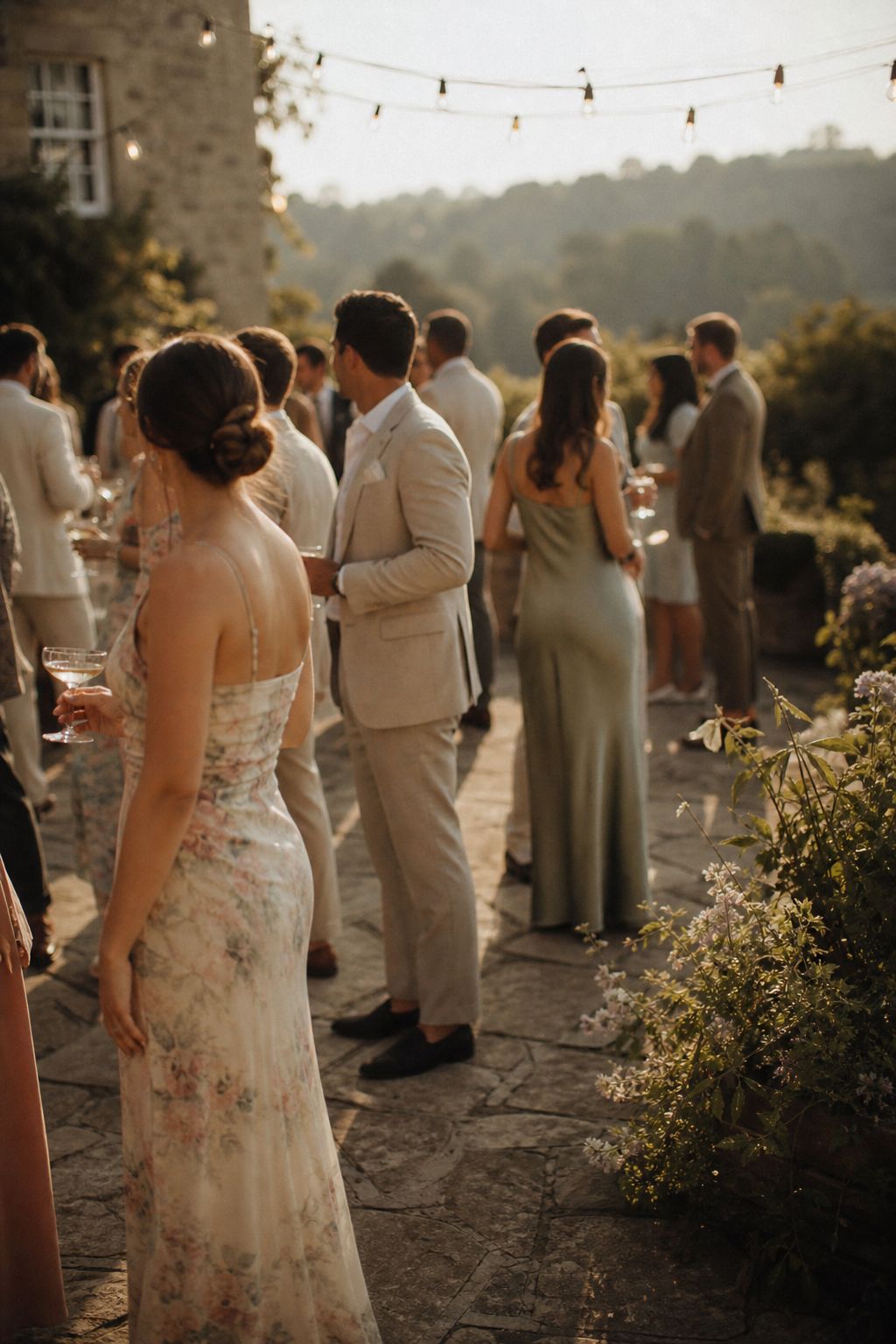Golden-hour drinks reception on the flagstone terrace